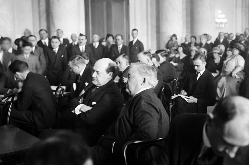 Harry F. Sinclair, multimillionaire oil magnate (L) appears with his counsel Martin W. Littleton during hearing on the Teapot Dome scandal in 1924. On April 7, 1922, petroleum reserves in Wyoming were leased without competitive bidding to private companies, resulting in the Teapot Dome scandal. File Photo by Library of Congress/UPI