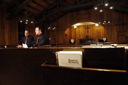 Darren Black Bear (L) and Jason Pickel wait to do interviews after being married by Darren's father Rev. Floyd Black Bear in El Reno, Oklahoma October 31, 2013. REUTERS/Rick Wilking