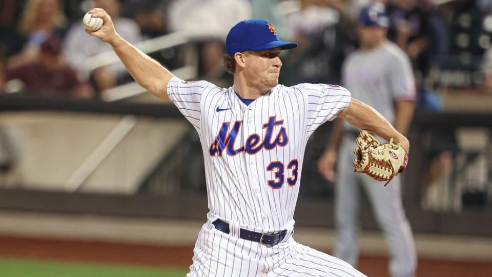 Aug 28, 2023; New York City, New York, USA; New York Mets relief pitcher Trevor Gott (33) delivers a pitch during the ninth inning against the Texas Rangers at Citi Field.