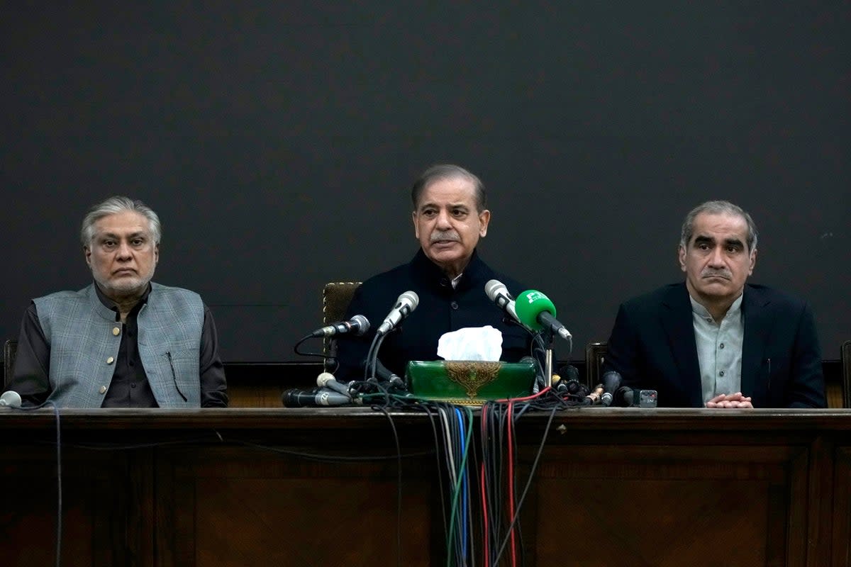 Pakistan's former Prime Minister Shehbaz Sharif, center speaks as his party aids Ishaq Dar, left, and Khawaja Saad Rafiq watch during a press conference regarding parliamentary elections, in Lahore, Pakistan (AP)