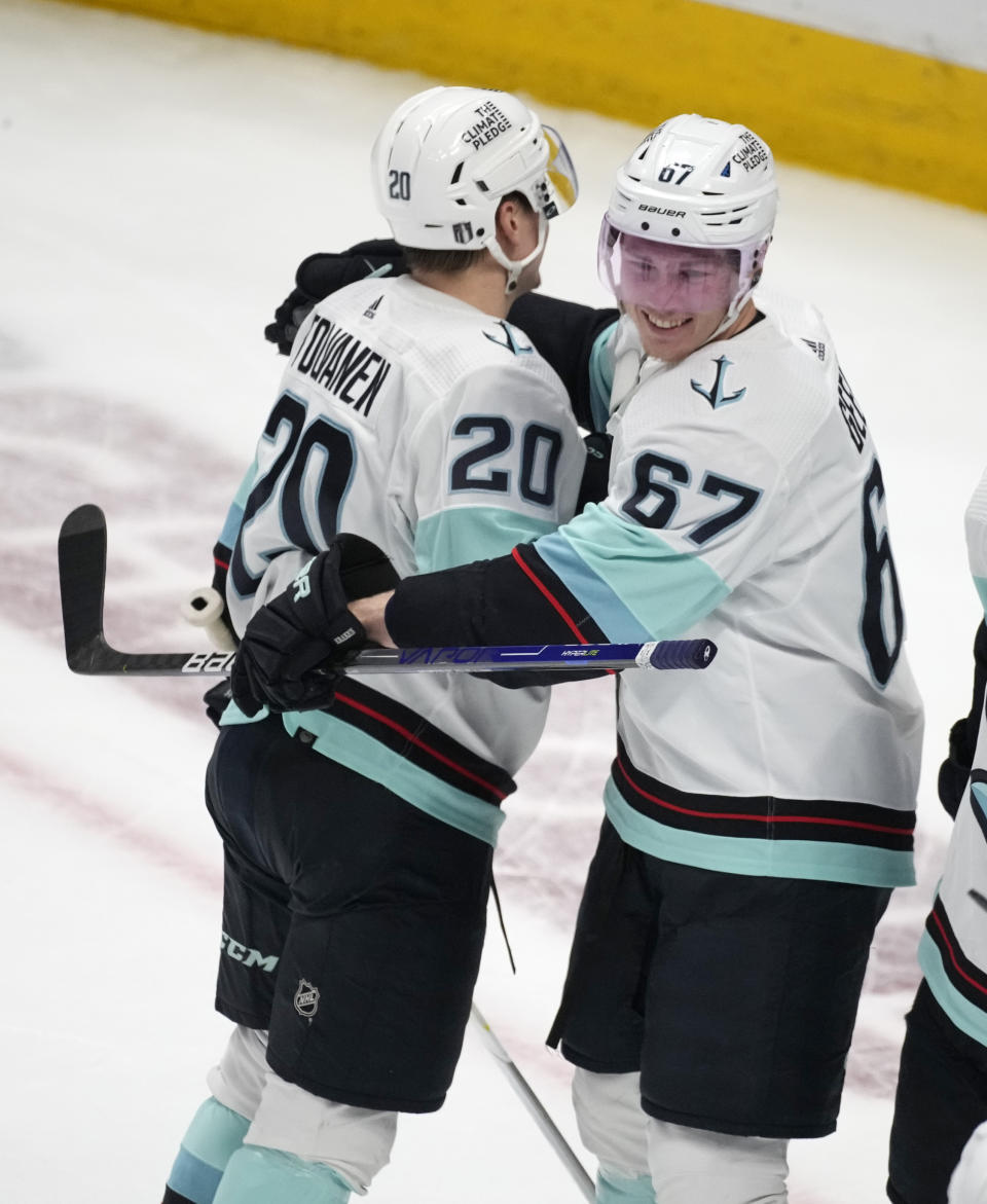 Seattle Kraken right wing Eeli Tolvanen, left, celbrates with center Morgan Geekie after the third period of Game 7 of an NHL first-round playoff series against the Colorado Avalanche Sunday, April 30, 2023, in Denver. The Kraken won 2-1 to advance to the next round. (AP Photo/David Zalubowski)