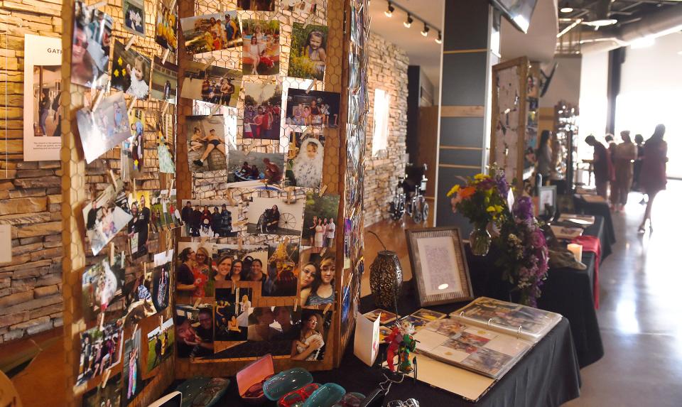 Photographs of Eden Mariah Montang's memories display in the lobby during a funeral service at Cornerstone Church in Ames on June 8.