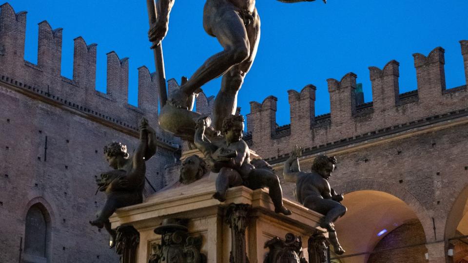 bologna, emilia romagna, italy neptune statue in piazza maggiore after sunset