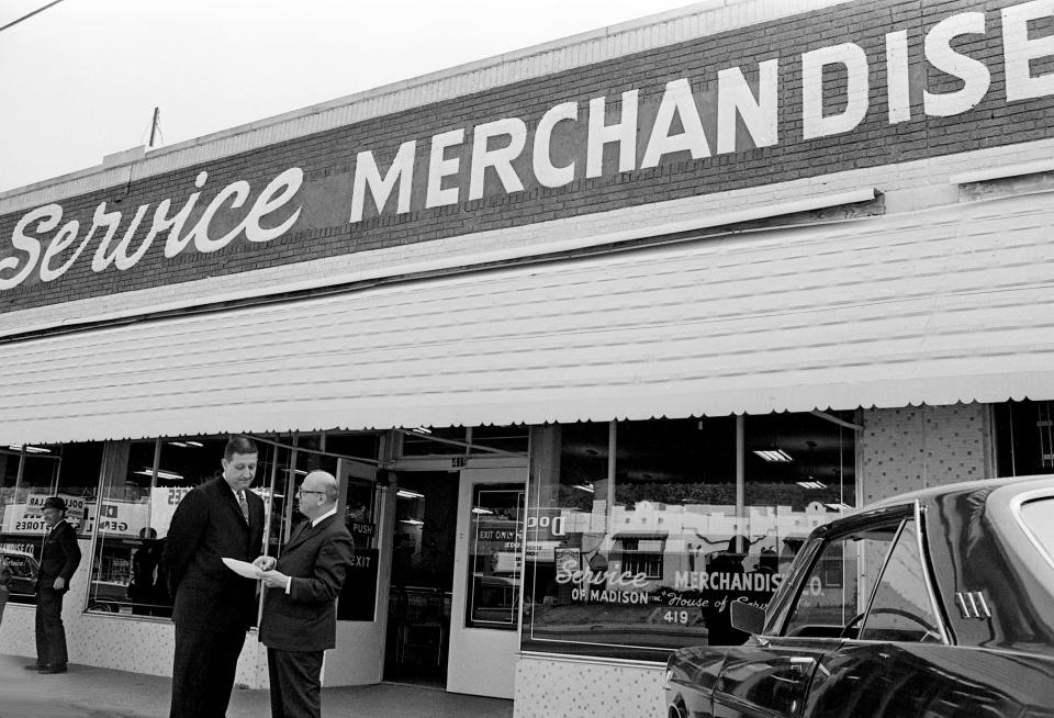 Service Merchandising Co. vice president Raymond Zimmerman, left, and president Harry Zimmerman talk after the ribbon cutting of their third store in Middle Tennessee at 419 Gallatin Road S. in Madison Sept. 26, 1967.