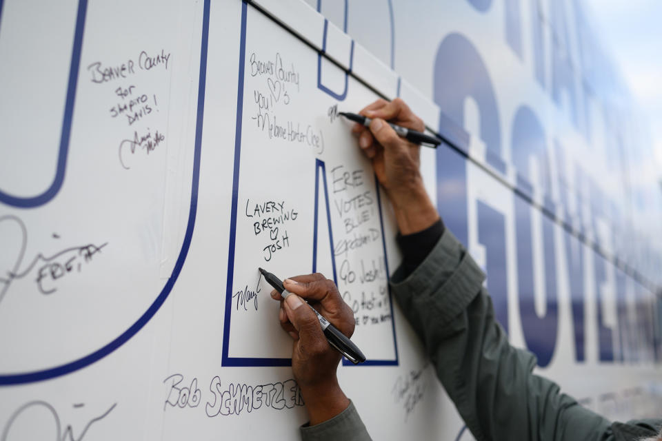 BEAVER, PA - NOVEMBER 1: People take turns signing Pennsylvania Attorney General Josh Shapiro, Democratic candidate for governors bus at a campaign stop on Tuesday, November 1, 2022 in Beaver, Pa. (Photo by Justin Merriman/For The Washington Post via Getty Images)