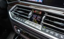 <p>Knurled knobs, modernized climate-control buttons, and shiny bits of trim bring more flair than we're used to finding in BMW's typically dour, businesslike cabins.</p>