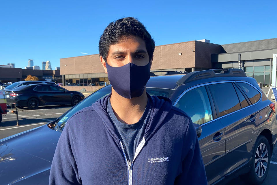 Rishi Khanna, 31, stands for a portrait after voting in Minneapolis, Tuesday, Nov. 2, 2021 to replace the city's police department with a new Department of Public Safety. Voters in Minneapolis are deciding whether to replace the city's police department with the new agency that comes more than a year after George Floyd's death launched a movement to defund or abolish police across the country. (AP Photo/Mohamed Ibrahim)