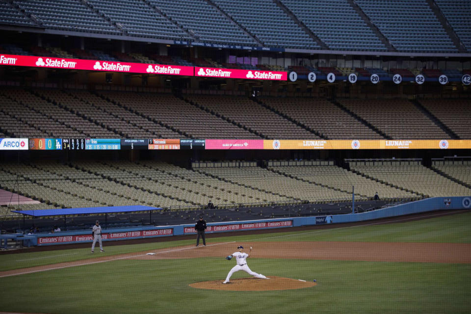 <div class="inline-image__caption"><p>With the seats at Dodger Stadium empty, Los Angeles Dodgers starting pitcher Julio Urias threw to a San Francisco Giants batter during the third inning of a baseball game on July 26, 2020, in Los Angeles.</p></div> <div class="inline-image__credit">Jae C. Hong/AP</div>
