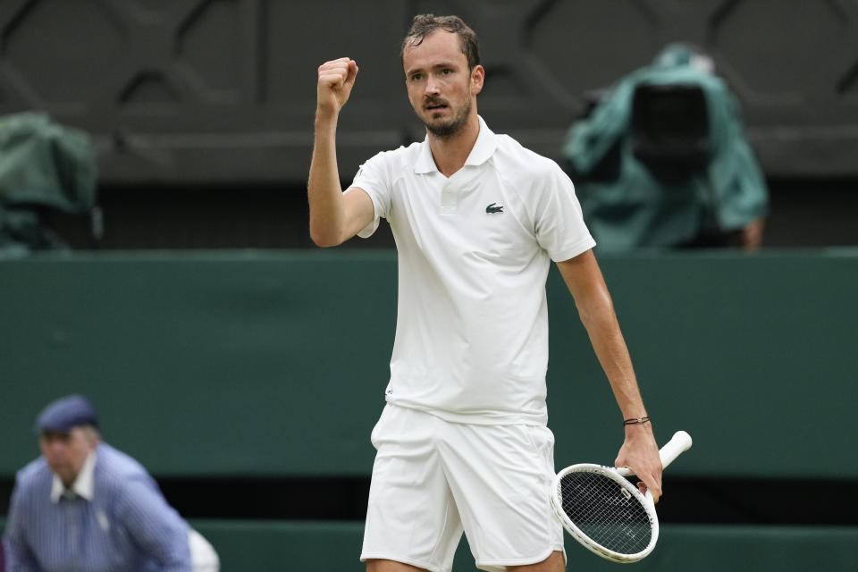 Daniil Medvedev of Russia reacts after winning a point against Jannik Sinner of Italy during their quarterfinal match at the Wimbledon tennis championships in London, Tuesday, July 9, 2024. (AP Photo/Alberto Pezzali)