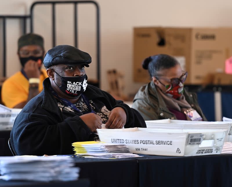 FILE PHOTO: Employees of the Fulton County Board of Registration and Elections process ballots in Atlanta