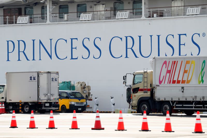 Workers load supplies for the cruise ship Diamond Princess at Daikoku Pier Cruise Terminal in Yokohama, south of Tokyo, Japan