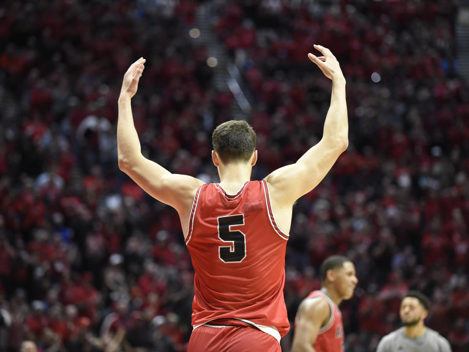 San Diego State forward Yanni Wetzell (5) celebrates after scoring during the second half of an NCAA college basketball game against Nevada Saturday, Jan. 18, 2020, in San Diego. (AP Photo/Denis Poroy)