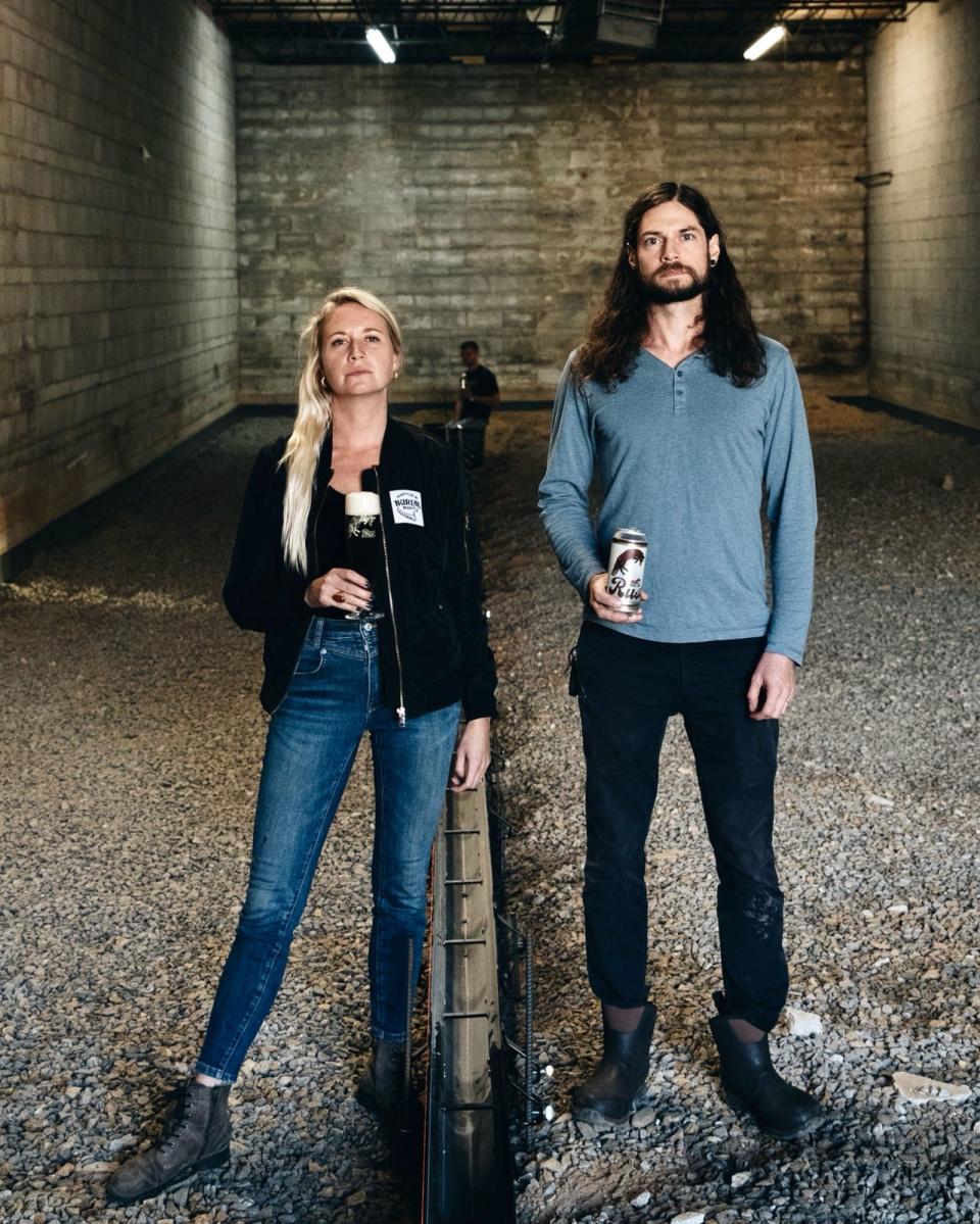 Burial Beer Company is expanding its South Slope location. Pictured:  Burial's co-owners Jessica Reiser (left), Timy Gormley (right) and Doug Reiser (middle-background).