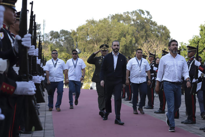 Salvador's President Nayib Bukele arrives at congress to begin an extraordinary meeting with opposition lawmakers, in San Salvador, El Salvador, Sunday, Feb. 9, 2020. The 39-year-old Bukele, a non-ideological pragmatist, is the latest in a string of Latin American presidents from across the political spectrum who have used elections and their personal popularity to amass power. (AP Photo/Salvador Melendez)