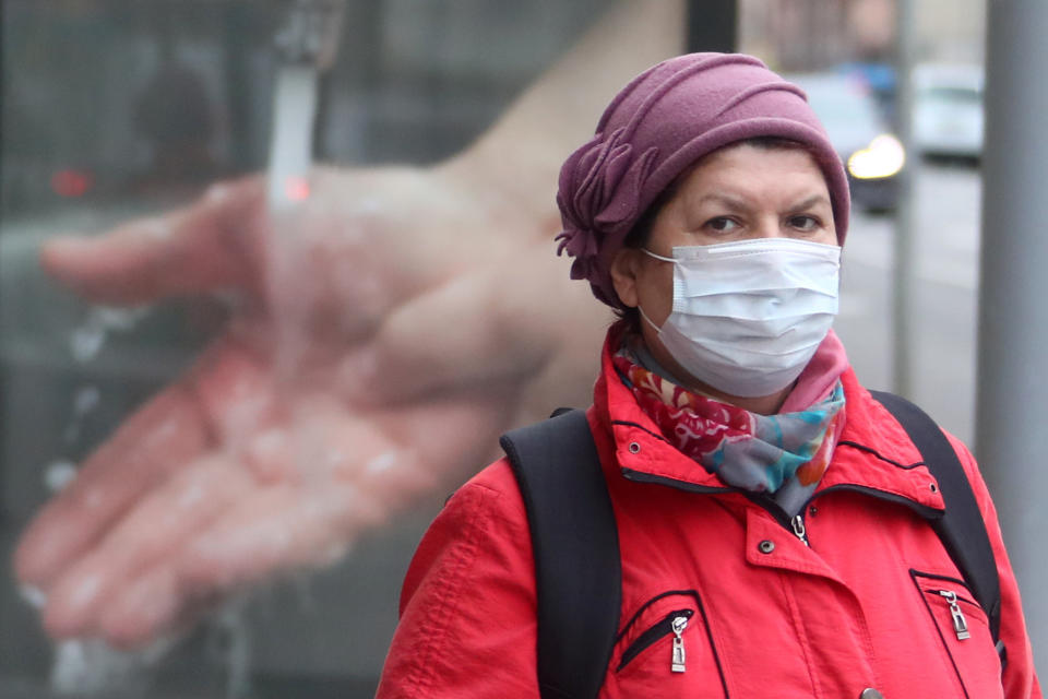 MOSCOW, RUSSIA - APRIL 6, 2020: A woman wears a face mask during a walk outside; a period off work with full pay has been extended until April 30 nationwide as part of preventive measures to contain the spread of the COVID-19 infection. Valery Sharifulin/TASS (Photo by Valery Sharifulin\TASS via Getty Images)