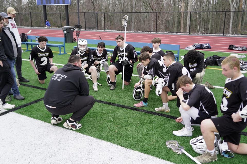 The entire Tiverton boys lacrosse team gathers to listen to head coach Shane Parker following the Tigers' 14-8 loss to Scituate on Thursday afternoon.