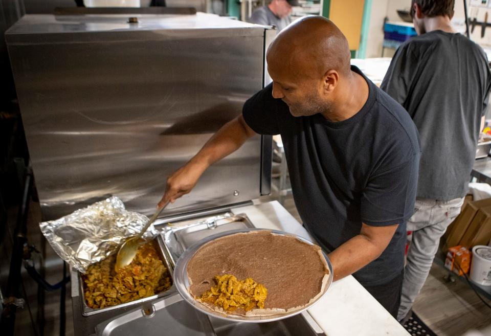 Paolos Kidanemariam works in the kitchen of his new Zagwe’s Restaurant which he opened with his wife Eden in the Whiteaker neighborhood earlier this month.