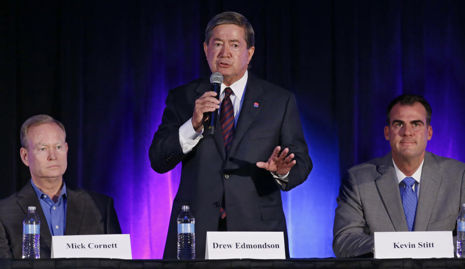 In this Friday, Aug. 24, 2018, photo Oklahoma Democratic gubernatorial candidate Drew Edmondson gestures as he speaks during a candidate forum in Oklahoma City. Looking on are Republican candidates Mick Cornett, left, and Kevin Stitt, right. Cornett and Stitt face each other in the Republican primary runoff election on Aug. 28. Edmondson will face the winner in November. (AP Photo/Sue Ogrocki)