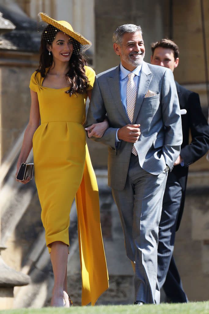 <p>Amal looked gorgeous in this yellow dress and matching hat at <a href="https://www.townandcountrymag.com/the-scene/weddings/a9936314/prince-harry-meghan-markle-wedding/" rel="nofollow noopener" target="_blank" data-ylk="slk:Prince Harry and Meghan Markle’s wedding;elm:context_link;itc:0;sec:content-canvas" class="link ">Prince Harry and Meghan Markle’s wedding</a>.</p>