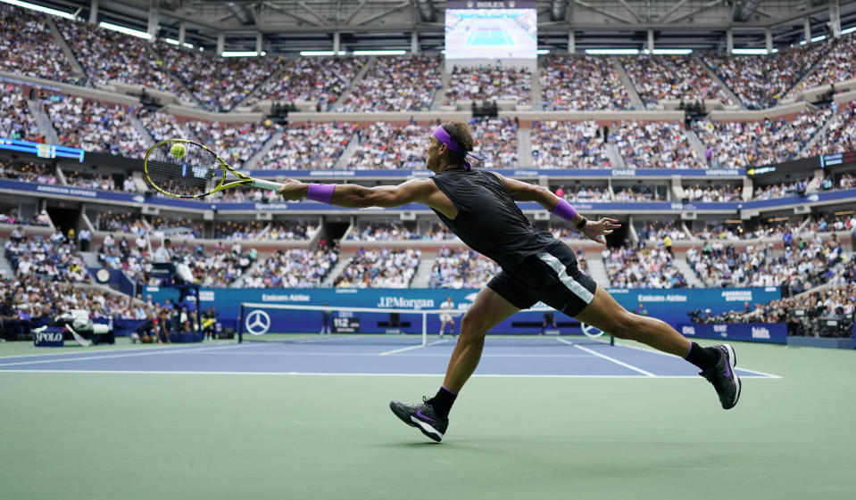 FILE - In this Sept. 8, 2019, file photo, Rafael Nadal, of Spain, returns a shot to Daniil Medvedev, of Russia, during the men's singles final at the U.S. Open tennis championships in New York. A high-ranking official for the U.S. Open tells the Associated Press that if the Grand Slam tennis tournament is held in 2020, she expects it to be at its usual site in New York and in its usual dates starting in August. (AP Photo/Eduardo Munoz Alvarez, File)