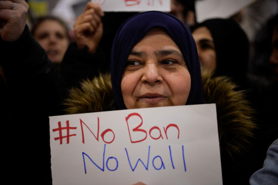 A Muslim women holds a sign during anti-travel ban protests outside Philadelphia International Airport in Philadelphia, Pennsylvania, U.S., Jan. 29, 2017.