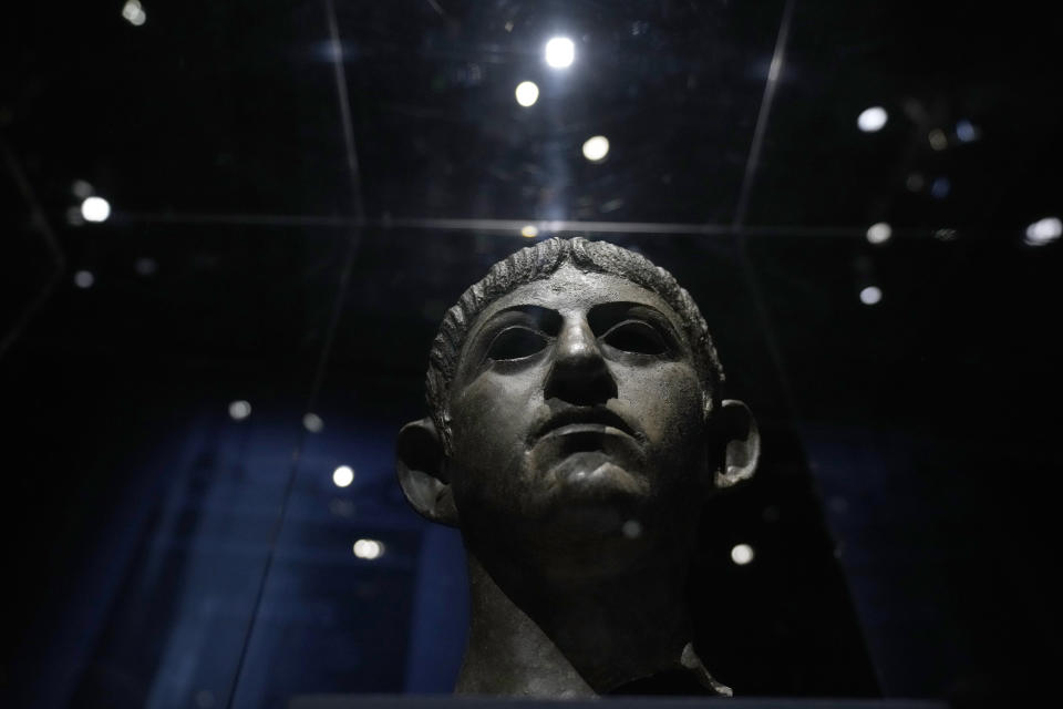 A bronze head of Roman emperor Nero dating from around AD 54-61 and found in the River Alde at Rendham in Suffolk, eastern England, is displayed during a media preview for the "Nero: the man behind the myth" exhibition, at the British Museum in London, Monday, May 24, 2021. The exhibition, which opens to visitors on May 27 and runs until October 24, explores the true story of Rome's fifth emperor informed by new research and archaeological evidence from the time. (AP Photo/Matt Dunham)