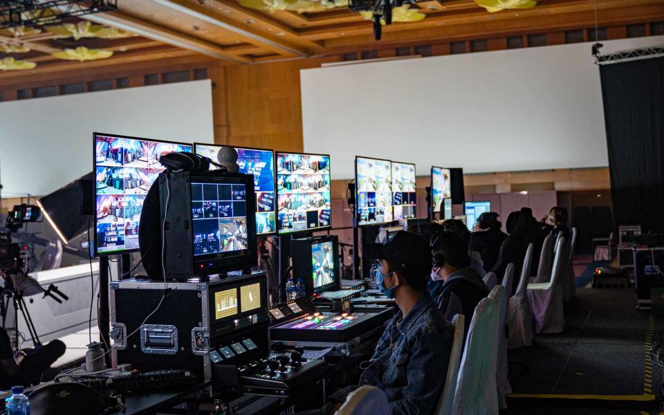 Images of a team sitting in front of monitors for production of an esports tournament. (Photo: Yahoo Esports SEA)