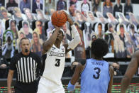 Providence's David Duke (3) shoots over Villanova's Brandon Slater (3) during an NCAA college basketball game in Providence, R.I., Saturday, March 6, 2021. Duke scored the winning basket to beat Villanova, 54-52. (AP Photo/Stew Milne)