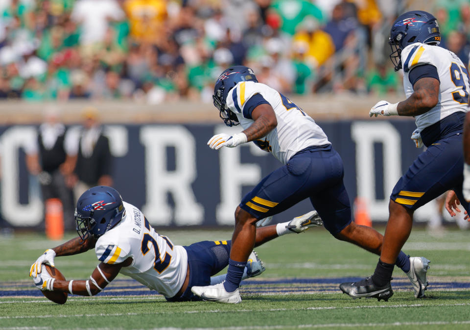 SOUTH BEND, IN – SEPTEMBER 11: Quinyon Mitchell #27 of the Toledo Rockets makes a fumble recovery during the first half against the Notre Dame Fighting Irish at Notre Dame Stadium on September 11, 2021 in South Bend, Indiana. (Photo by Michael Hickey/Getty Images)