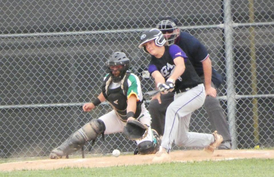 Granville Christian freshman Bentley Johnson hits a ground ball against Newark Catholic during a Division IV district semifinal on Monday, May 23, 2022. The Green Wave beat the visiting Lions 14-1.