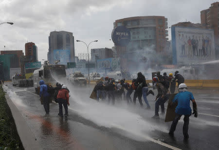 Demonstrators clash with riot security forces while rallying against Venezuela's President Nicolas Maduro in Caracas, Venezuela, May 31, 2017. REUTERS/Carlos Garcia Rawlins