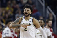 Michigan forward Isaiah Livers walks to the bench after a play during the second half of the team's NCAA college basketball game against Indiana, Sunday, Feb. 16, 2020, in Ann Arbor, Mich. (AP Photo/Carlos Osorio)