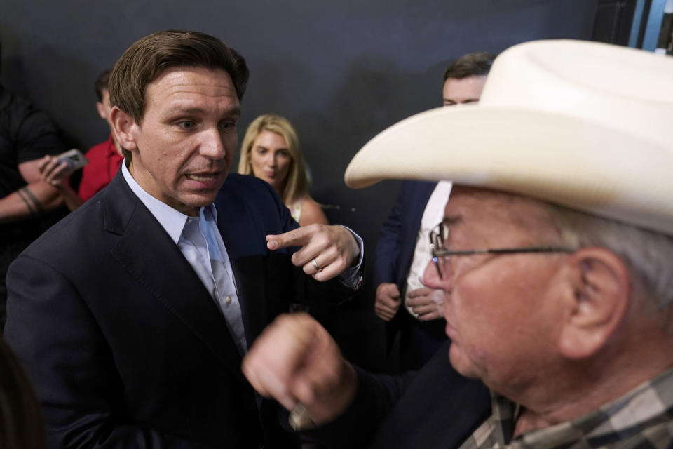 Republican presidential candidate Florida Gov. Ron DeSantis greets audience members during a campaign event, Tuesday, May 30, 2023, in Clive, Iowa. (AP Photo/Charlie Neibergall)