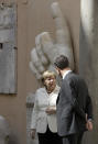 German Chancellor Angela Merkel, left, speaks with Dutch Prime Minister Mark Rutte after a group photo in the Cortile di Michelangelo during an EU summit in Rome on Saturday, March 25, 2017. EU leaders were gathering in Rome to mark the 60th anniversary of their founding treaty and chart a way ahead following the decision of Britain to leave the 28-nation bloc. In the background the remaining marble right hand of the Colossus of Constantine (312-315 AD). (AP Photo/Andrew Medichini)