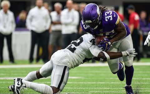 Minnesota Vikings running back Dalvin Cook (33) runs the ball as Oakland Raiders free safety Karl Joseph (42) goes for the tackle during the second quarter at U.S. Bank Stadium - Credit: USA Today