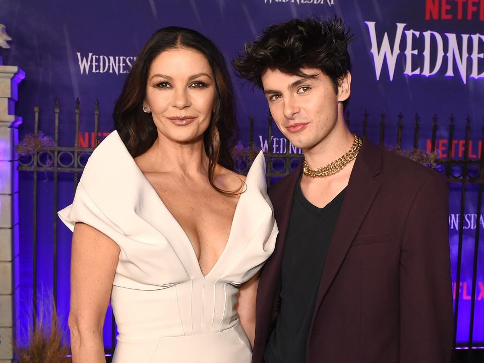 Catherine Zeta-Jones and Dylan Michael Douglas at the premiere of Netflix's "Wednesday" held at Hollywood Legion Theater on November 16, 2022 in Los Angeles, California