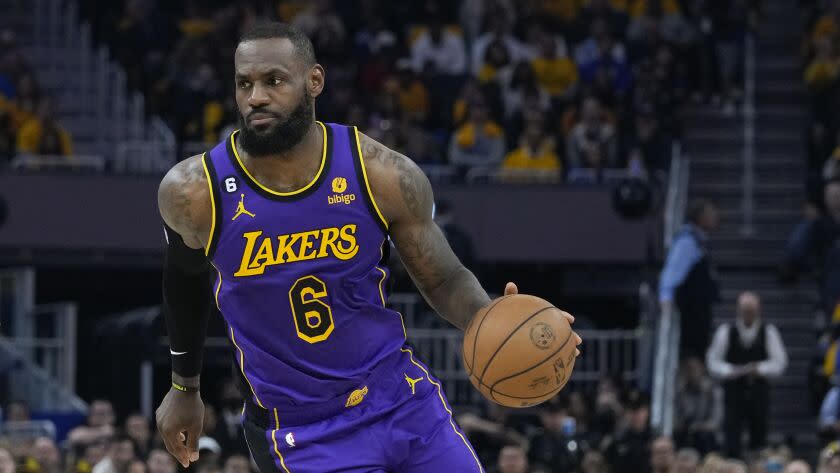 Lakers forward LeBron James dribbles during a playoff game against the Golden State Warriors in San Francisco Thursday.