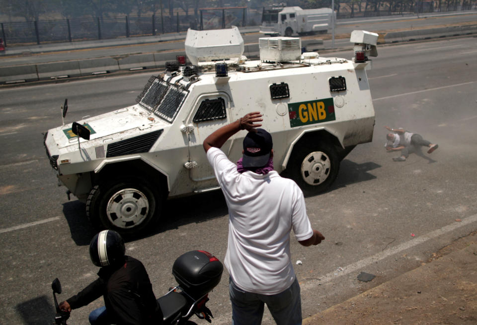 An opposition demonstrator is struck by a Venezuelan National Guard vehicle on a street near the Generalisimo Francisco de Miranda Airbase "La Carlota" in Caracas, Venezuela April 30, 2019. (Photo: Ueslei Marcelino/Reuters)