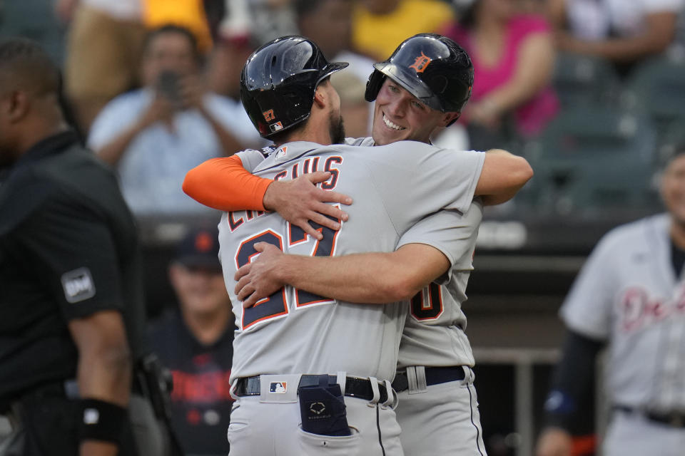 Detroit Tigers' Kerry Carpenter, right, hugs Andre Lipcius after Lipcius hit a home run during the first inning of a baseball game against the Chicago White Sox, Saturday, Sept. 2, 2023, in Chicago. (AP Photo/Erin Hooley)