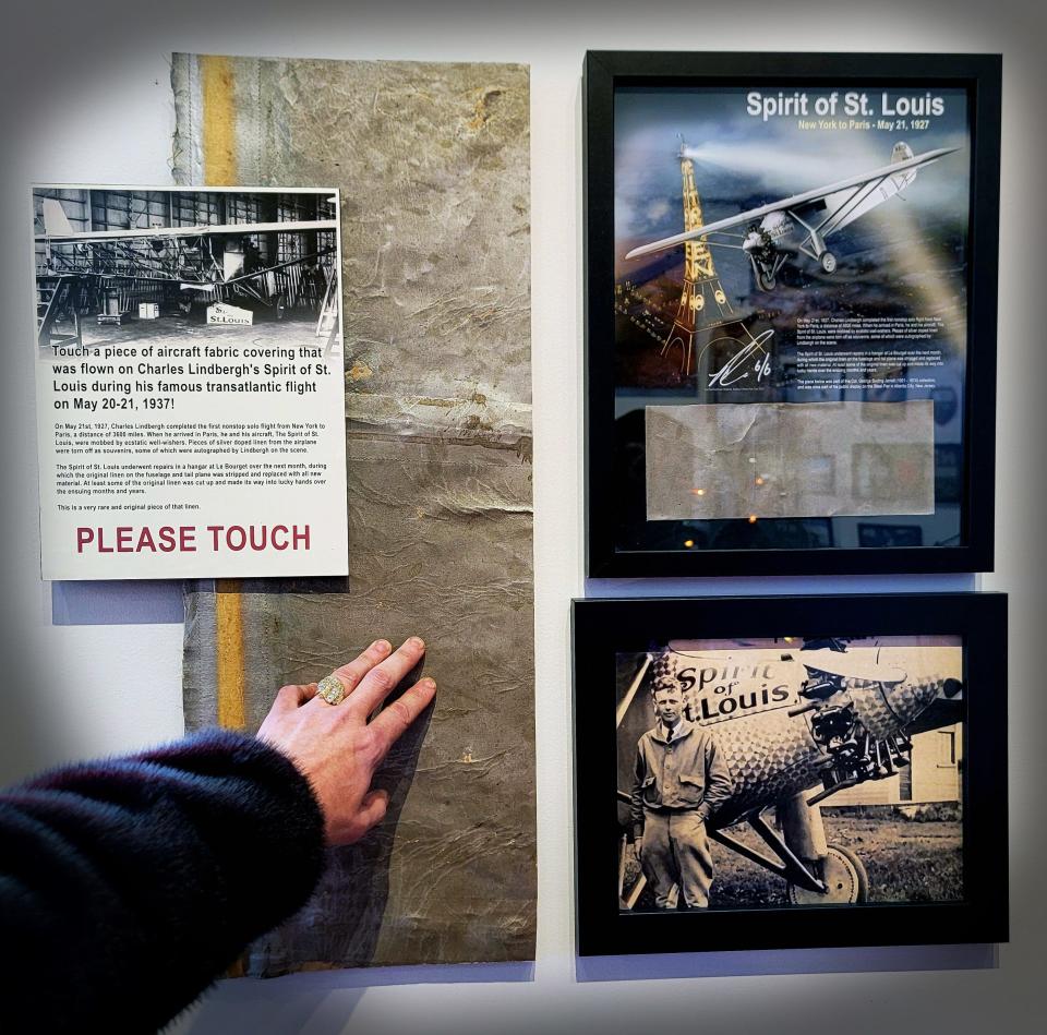 An interactive display featuring the linen that covered Charles Lindberg's Spirit of St. Louis aircraft can be seen at the Ron & Erin Cole Aircraft Aviation Gallery as part of the First Friday Art Walk.