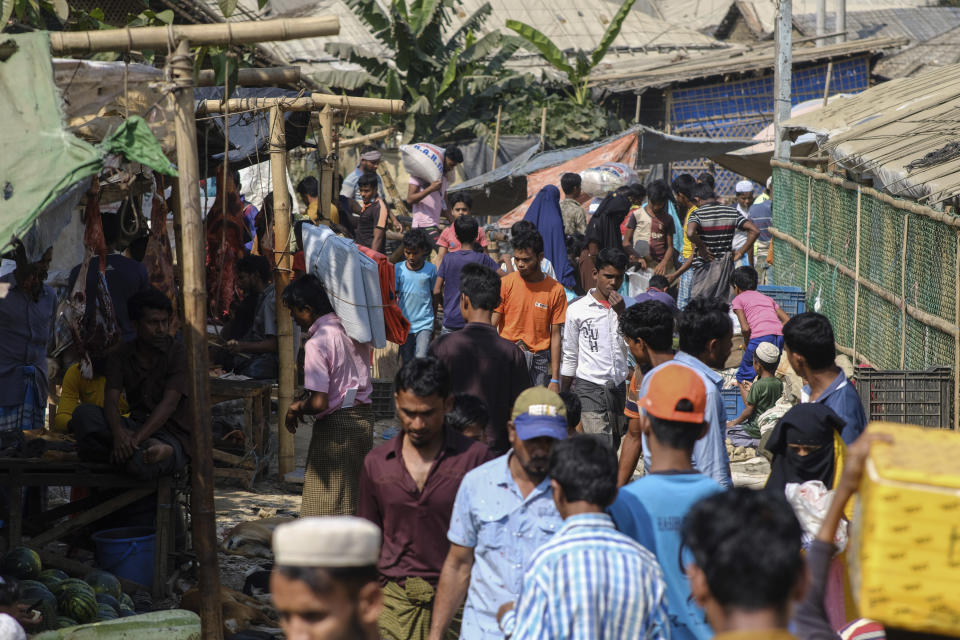 People walk through a Rohingya refugee camp in the Cox's Bazar district of Bangladesh, on March 9, 2023. (AP Photo/Mahmud Hossain Opu)