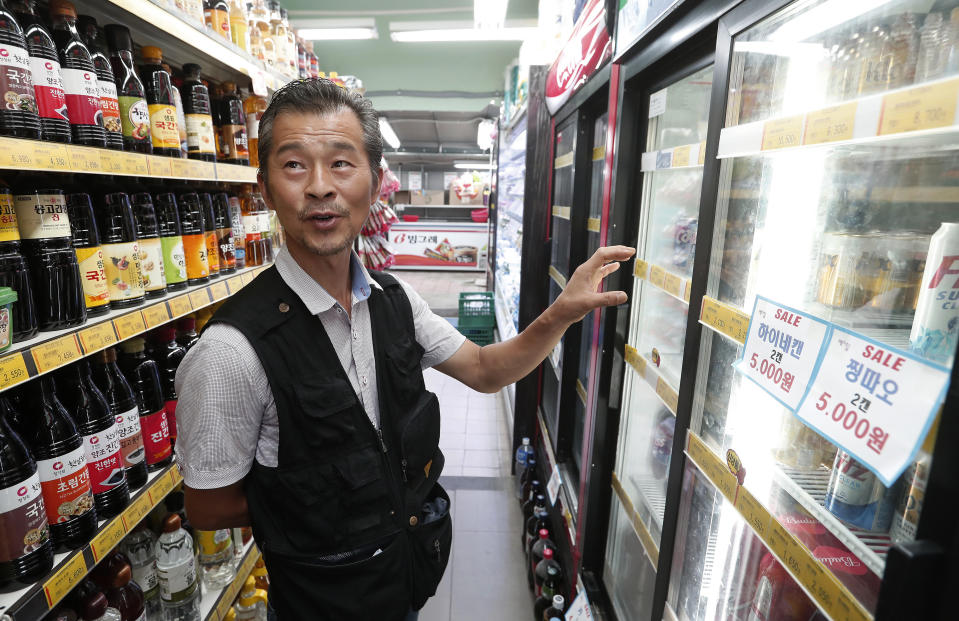 In this July 30, 2019, photo, Dan Kil-su, 51 and owner of Seoul's Heemang (Hope) supermarket who removed all Japanese products from store shelves on July 5, speaks during an interview at his store in Seoul, South Korea. “Even without Japanese products, there are still lots of things to sell and customers aren’t actually looking for Japanese products,” said Dan. A widespread anti-Japanese boycott has gained ground in South Korea since Tokyo tightened its exports of materials used to manufacture semiconductors and display screens, key export items for South Korea. (AP Photo/Ahn Young-joon)