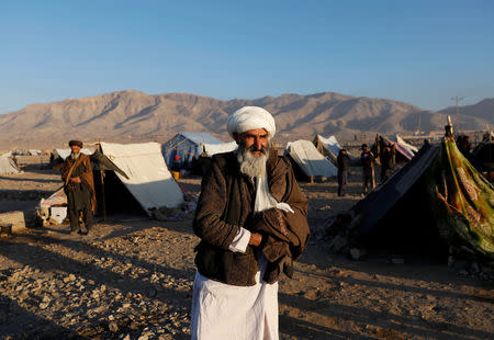 Internally displaced Afghan man walks at a refugee camp in Herat province, Afghanistan October 14, 2018. Picture taken October 14, 2018. REUTERS/Mohammad Ismail