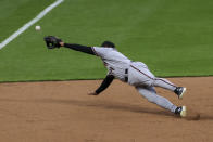 Arizona Diamondbacks' Asdrubal Cabrera dives for but it unable to field a ball hit by Cincinnati Reds' Luis Castillo for a double during the third inning of a baseball game in Cincinnati, Tuesday, April 20, 2021. (AP Photo/Aaron Doster)