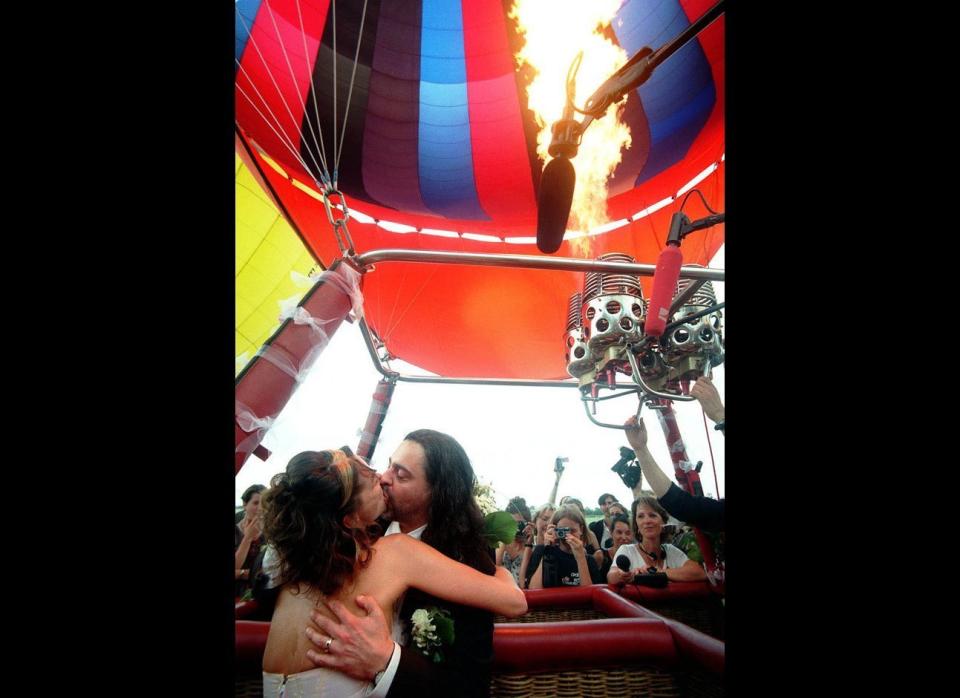 Full of Hot Air: This bride and groom were full of hot air on their big day in Berlin. Christof Galuschka, right, and Evelyn Neew locked lips on July 22, 1998, aboard a hot-air balloon that was set to take off during their vows. Unfortunately, just two days before the wedding, authorization for their sky-high nuptials was yanked, bursting the bubble on what would've been Germany's first-ever hot-air balloon wedding. The couple went ahead with the prop, knowing their ceremony wouldn't be valid, and vowed to make their union official later. 