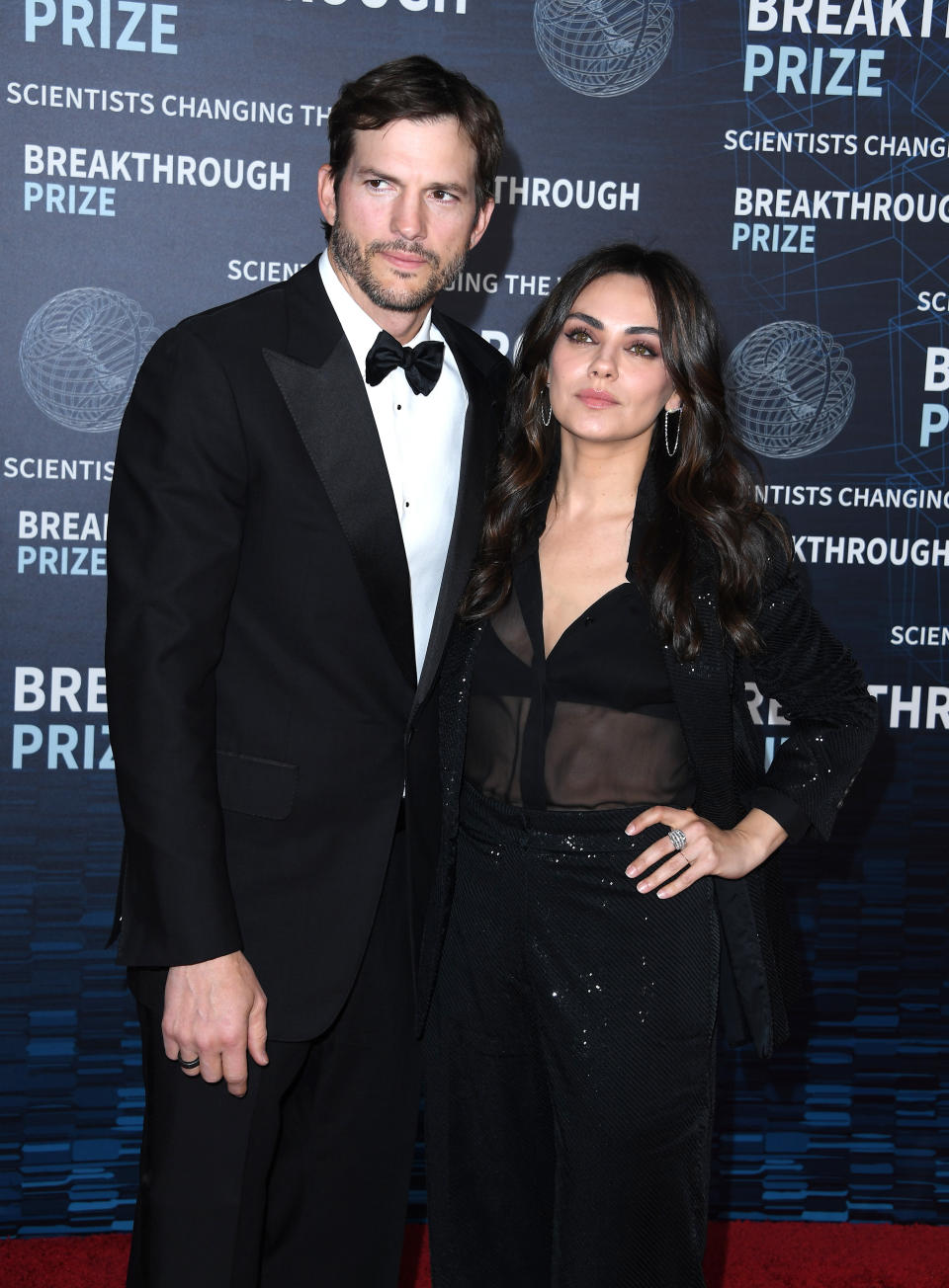 A closeup of ashton and mila on the red carpet