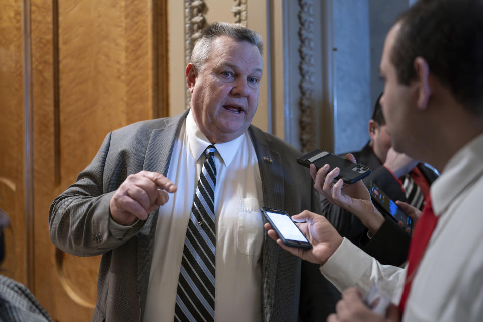 Sen. Jon Tester, D-Mont., speaks with reporters about the border security talks, outside the chamber at the Capitol in Washington, Thursday, Jan. 25, 2024. Any bipartisan border deal could be doomed because of resistance from former President Donald Trump. (AP Photo/J. Scott Applewhite)