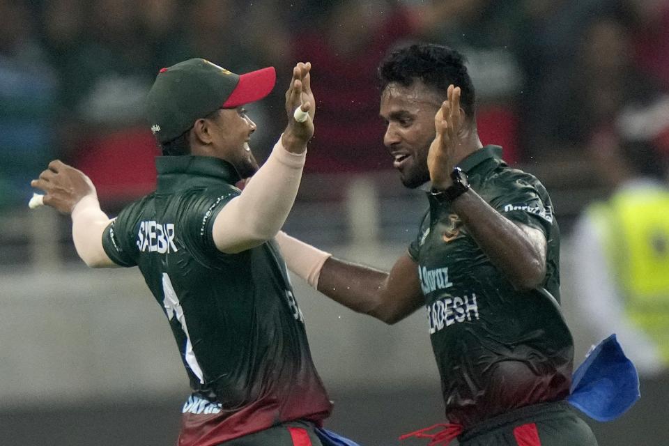 Bangladesh's Ebadot Hossain celebrates with teammate after taking the wicket of Sri Lanka's Danushka Gunathilaka during the T20 cricket match of Asia Cup between Bangladesh and Sri Lanka, in Dubai, United Arab Emirates, Thursday, Sept. 1, 2022. (AP Photo/Anjum Naveed)