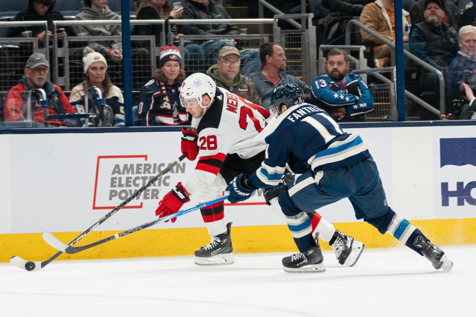 Dec 16, 2023; Columbus, Ohio, USA;
Columbus Blue Jackets center Adam Fantilli (11) fights New Jersey Devils right wing Timo Meier (28) for the puck during the second period of their game on Saturday, Dec. 16, 2023 at Nationwide Arena.