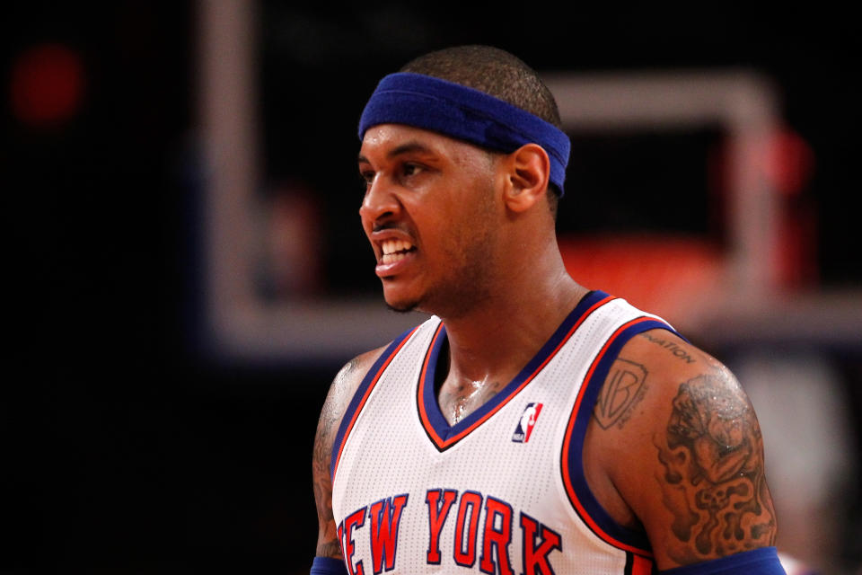 NEW YORK, NY - MAY 06: Carmelo Anthony #7 of the New York Knicks reacts in the second half against the Miami Heat in Game Four of the Eastern Conference Quarterfinals in the 2012 NBA Playoffs on May 6, 2012 at Madison Square Garden in New York City. NOTE TO USER: User expressly acknowledges and agrees that, by downloading and or using this photograph, User is consenting to the terms and conditions of the Getty Images License Agreement (Photo by Jeff Zelevansky/Getty Images)